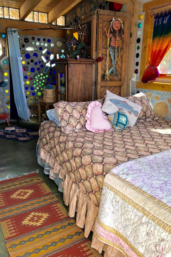 Prepare to be delighted by the charming bedroom of this breathtaking tiny house