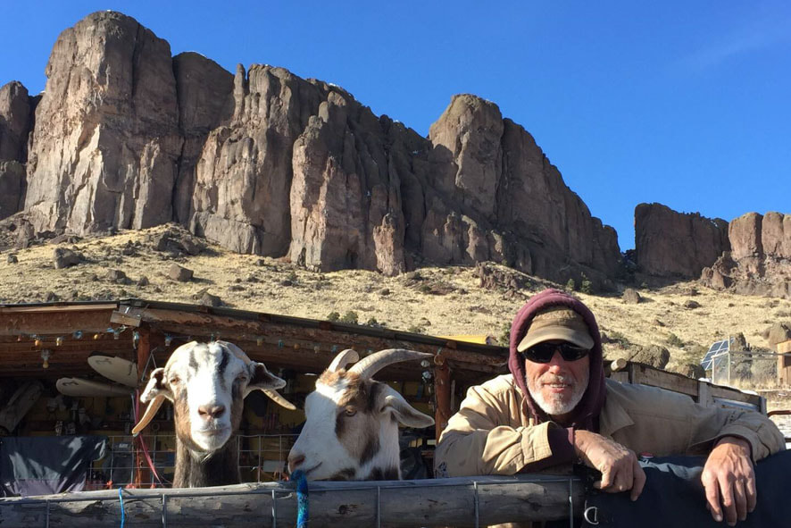 Michael and his goats enjoying a peaceful moment together